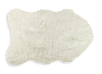 Drape this 2x3 faux pelt from Saks Off5th for $24.99 over the rattan chair for a soft look