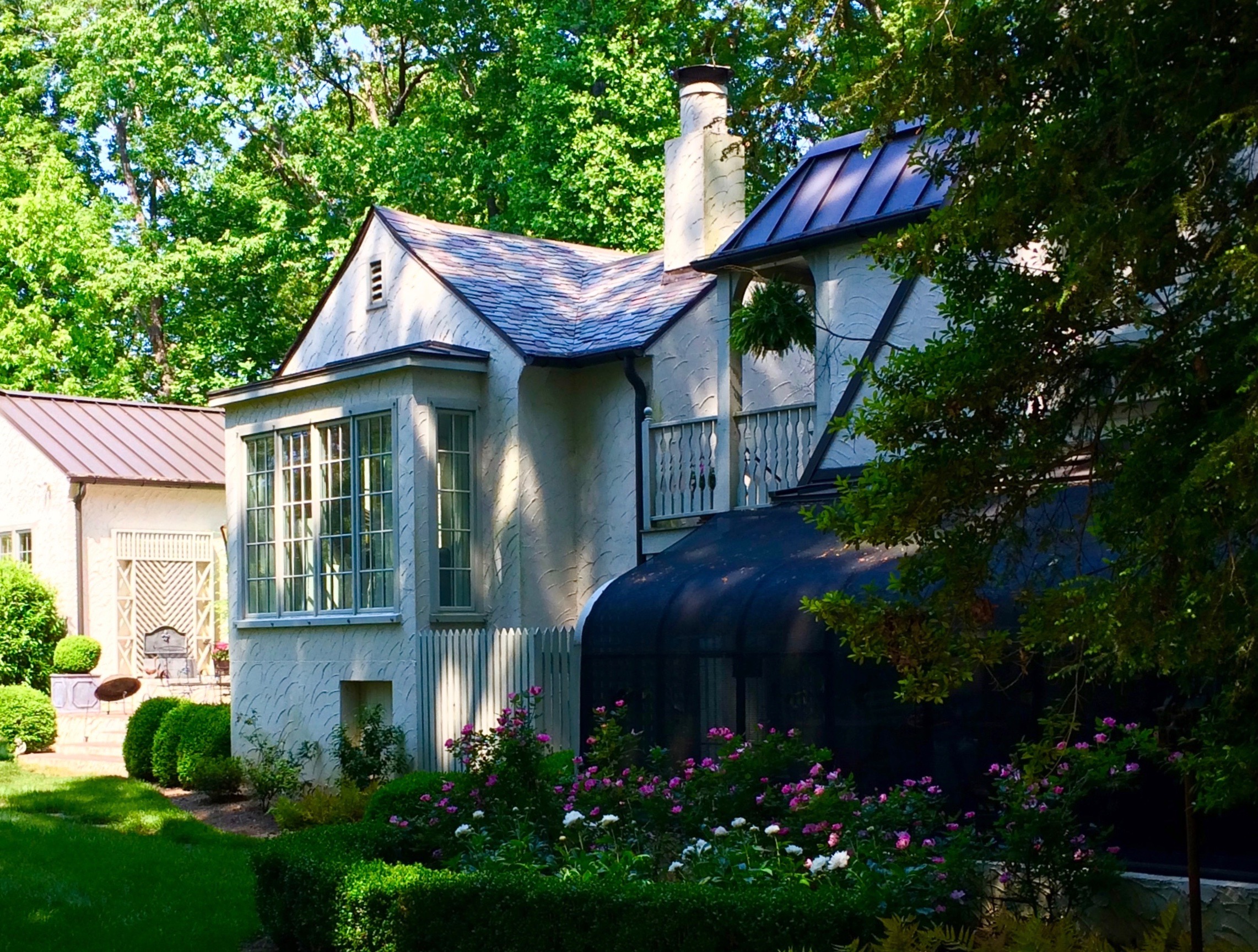 Boxwood, roses and peonies are staples in an established yard.