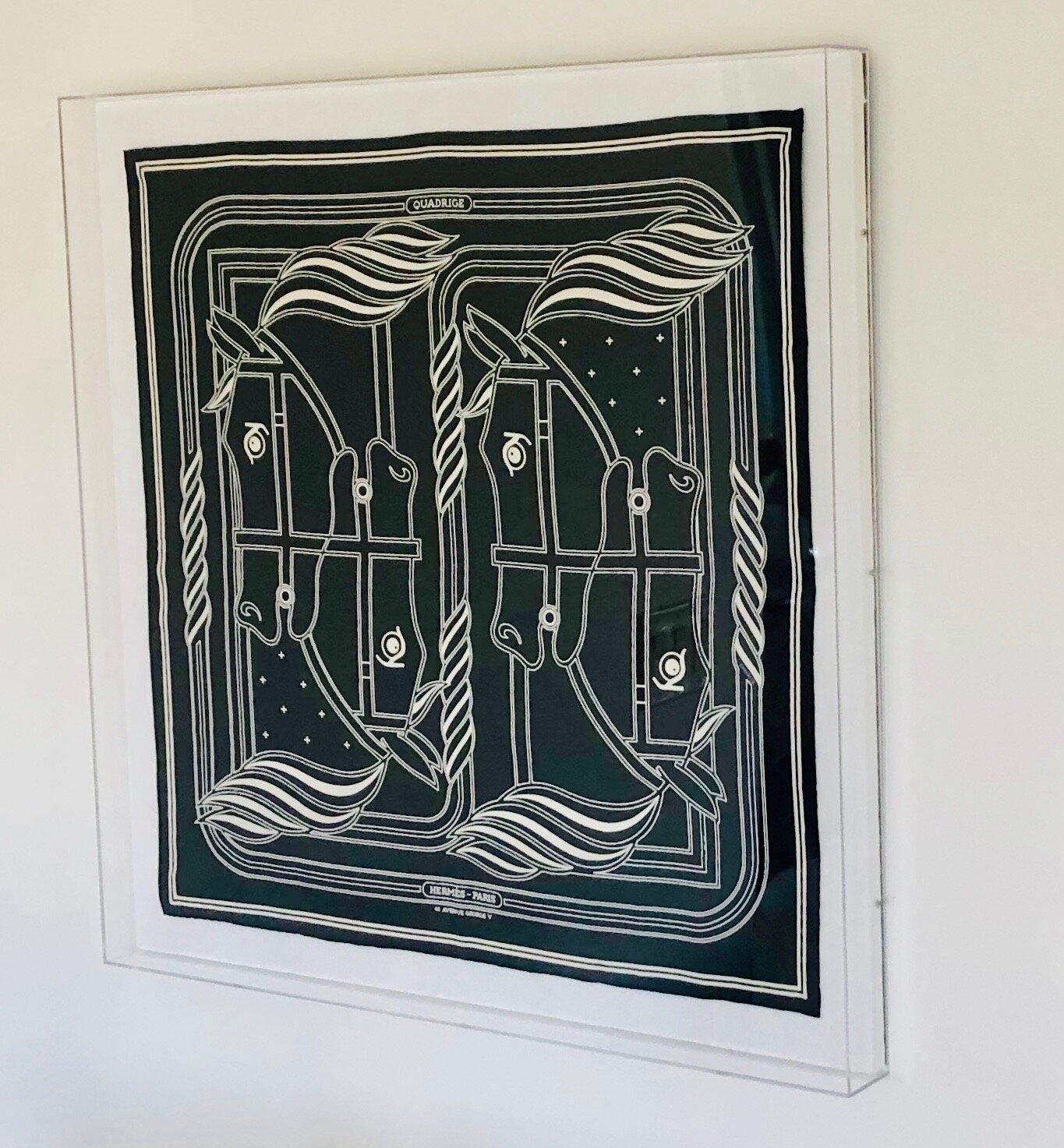 I framed this graphic black and white Hermes scarf in an acrylic floating frame. Framing a scarf is one of my tricks for creating instant large art. Check out my blog post about that here .