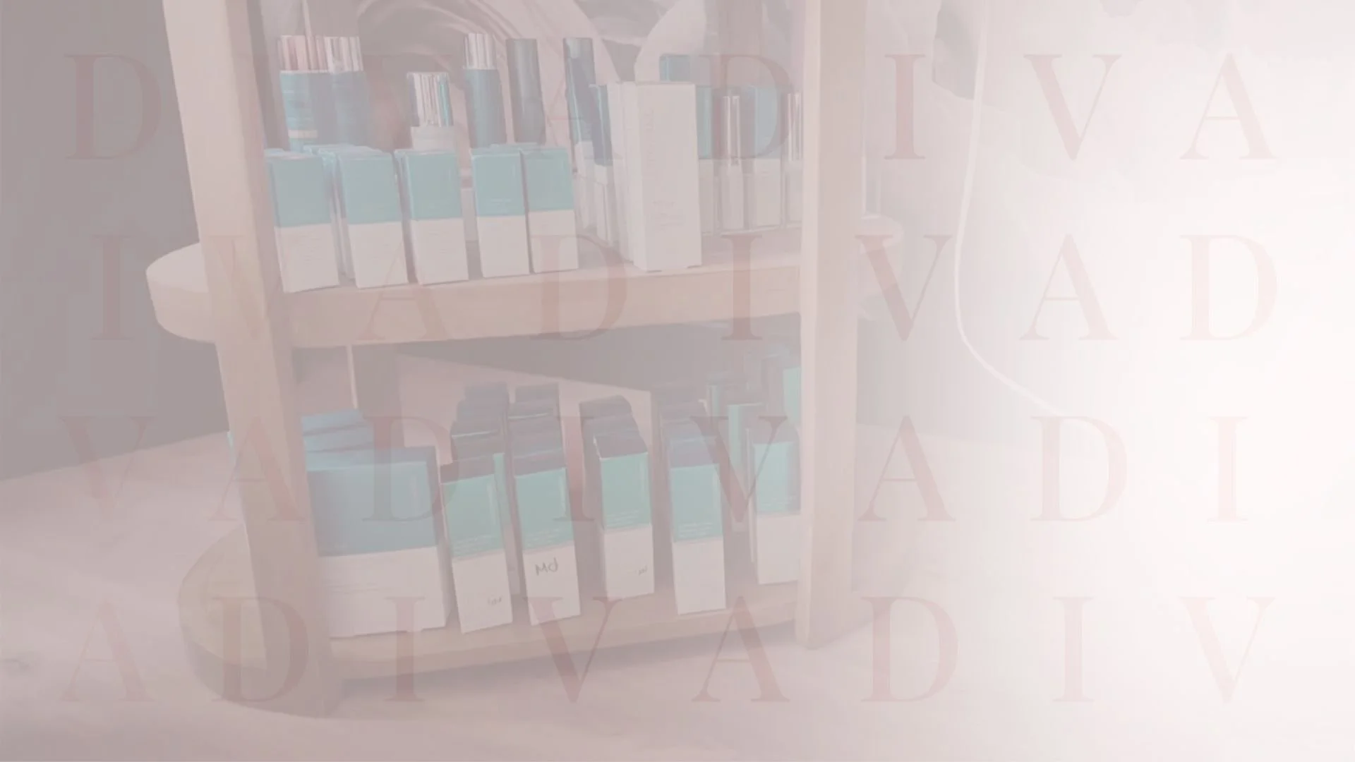 A wooden bookshelf filled with medical grade skincare a room with a partially visible door