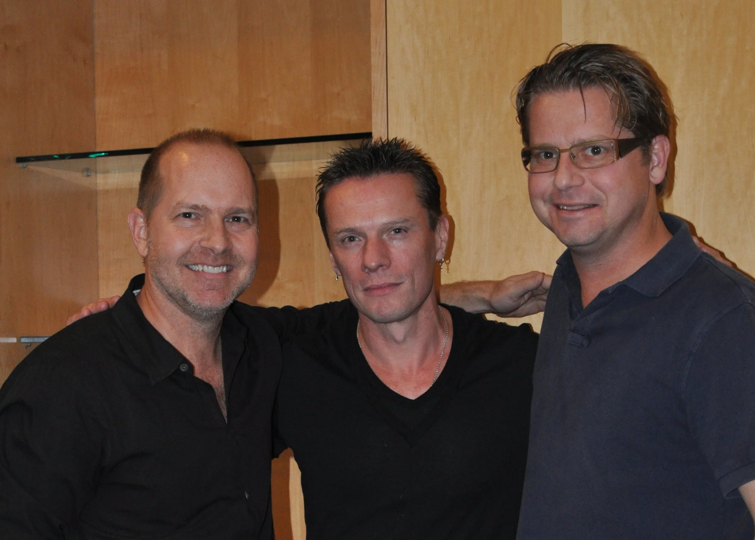 Mike and Patrick Henry with U2’s Larry Mullen Jr.