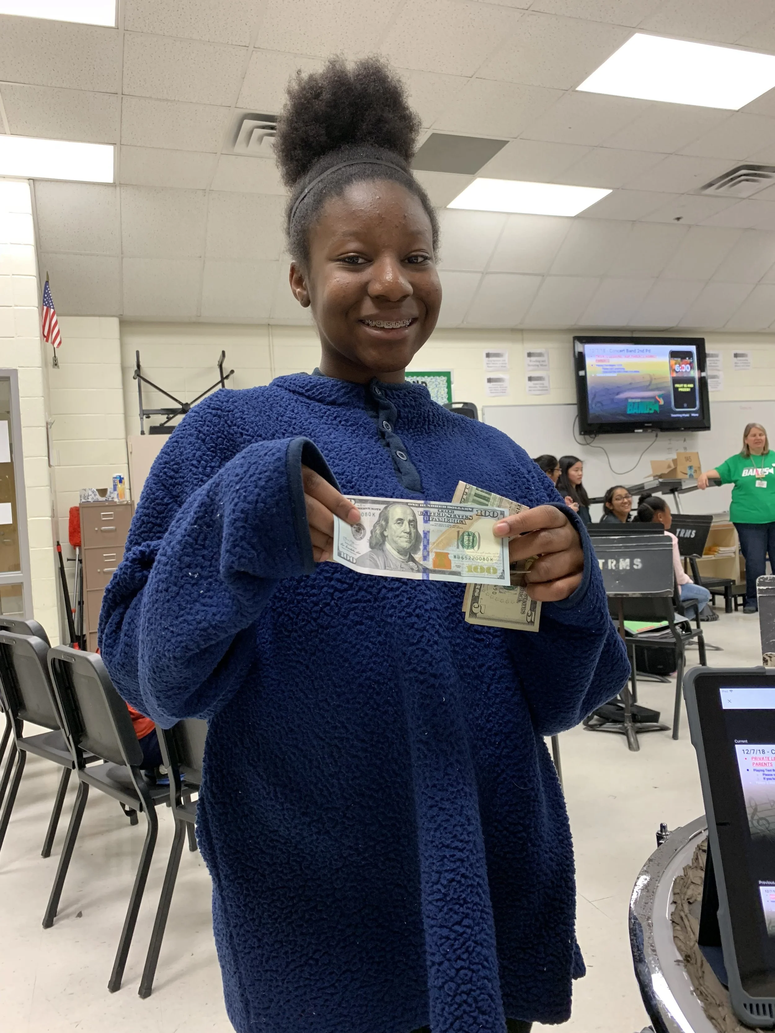 Dami was the lucky one to draw the $100 from the fruit sale!
