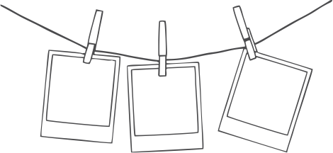 Three blank Polaroid photos hanging on a clothesline with clothespins.