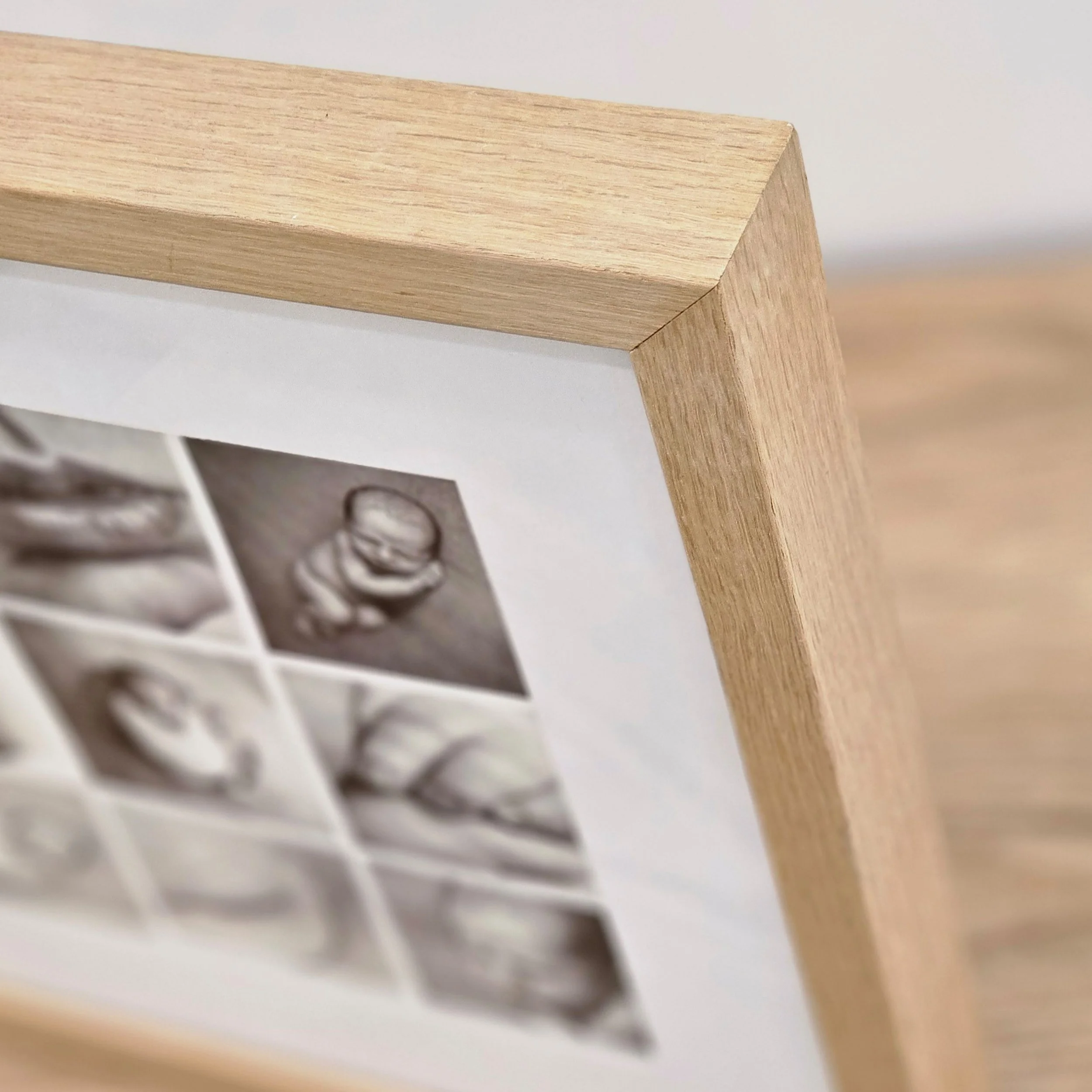 Close up of 9up collage framed print oak