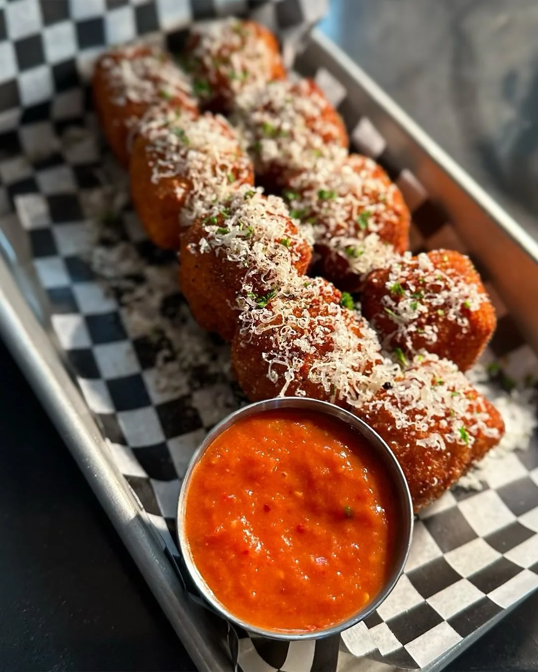 LUNCH AT ODD COMPANY‼️ *ding ding ding!* 

(Your inbox will still be there in an hour)

Our crispy, cheesy Cacio e Pepe appetizer is now available in bite-sized pieces - making &lsquo;em even more shareable, which technically counts as &ldquo;team bu