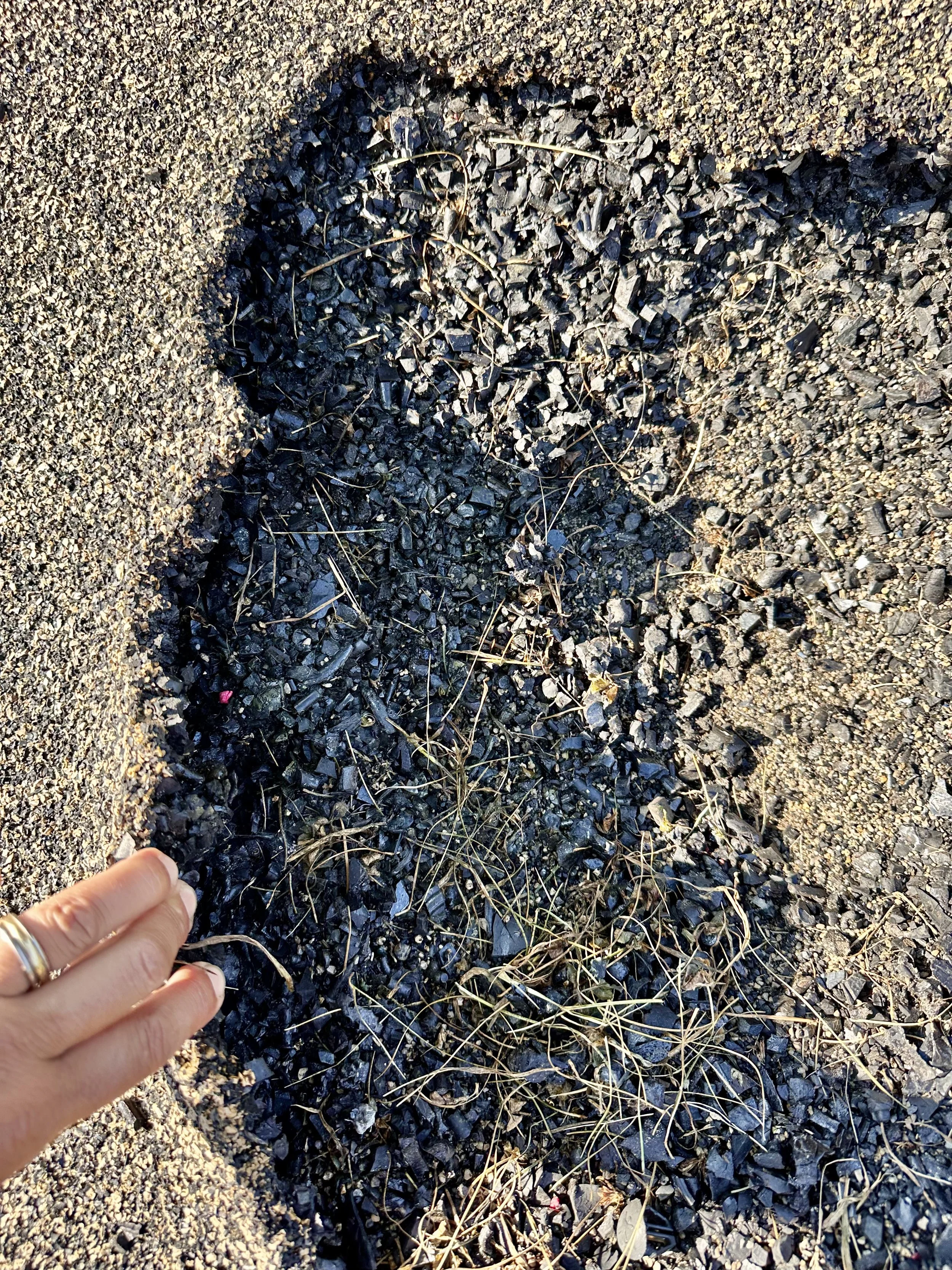 One of the holes that had opened up in the playground surface
