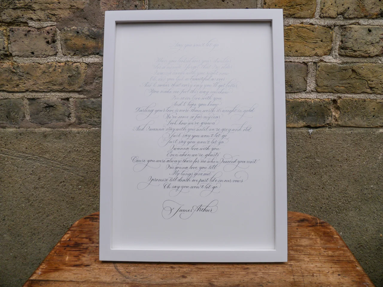 Full shot of finished graded watercolour calligraphy from light to dark