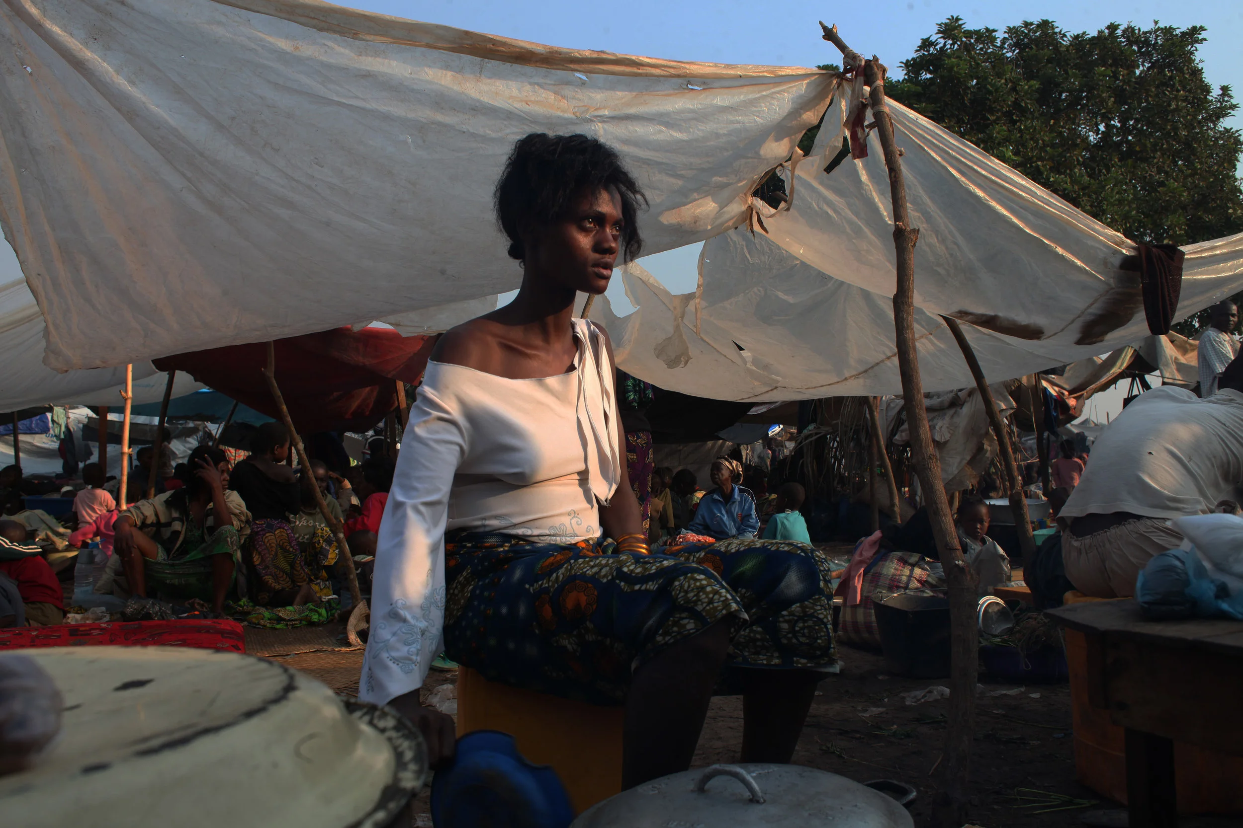 A woman is cooking in the IPDs camp by the airport in Bangui, in December 2013.