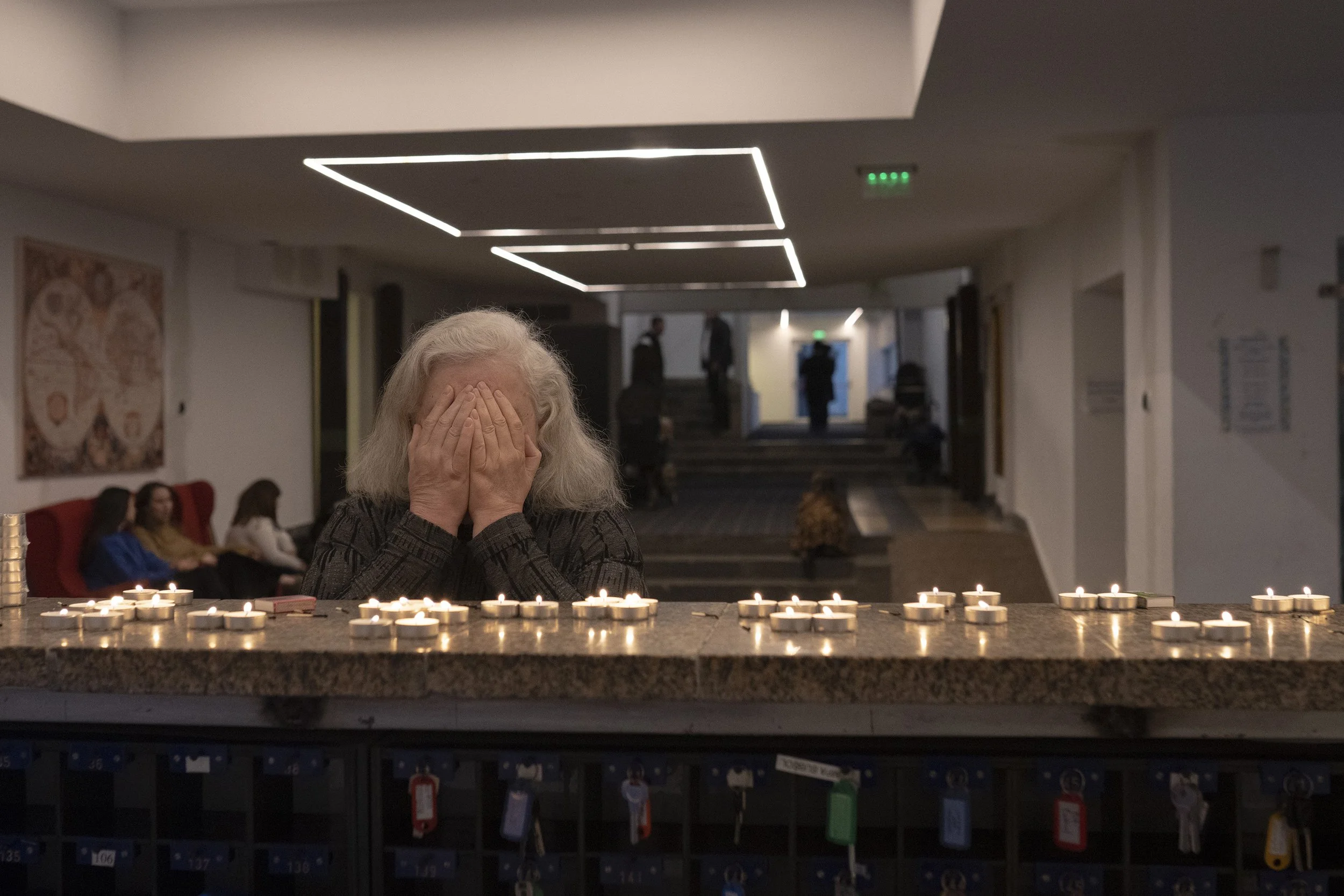  A woman prays before the beginning of Shabbat in the hotel lobby.  