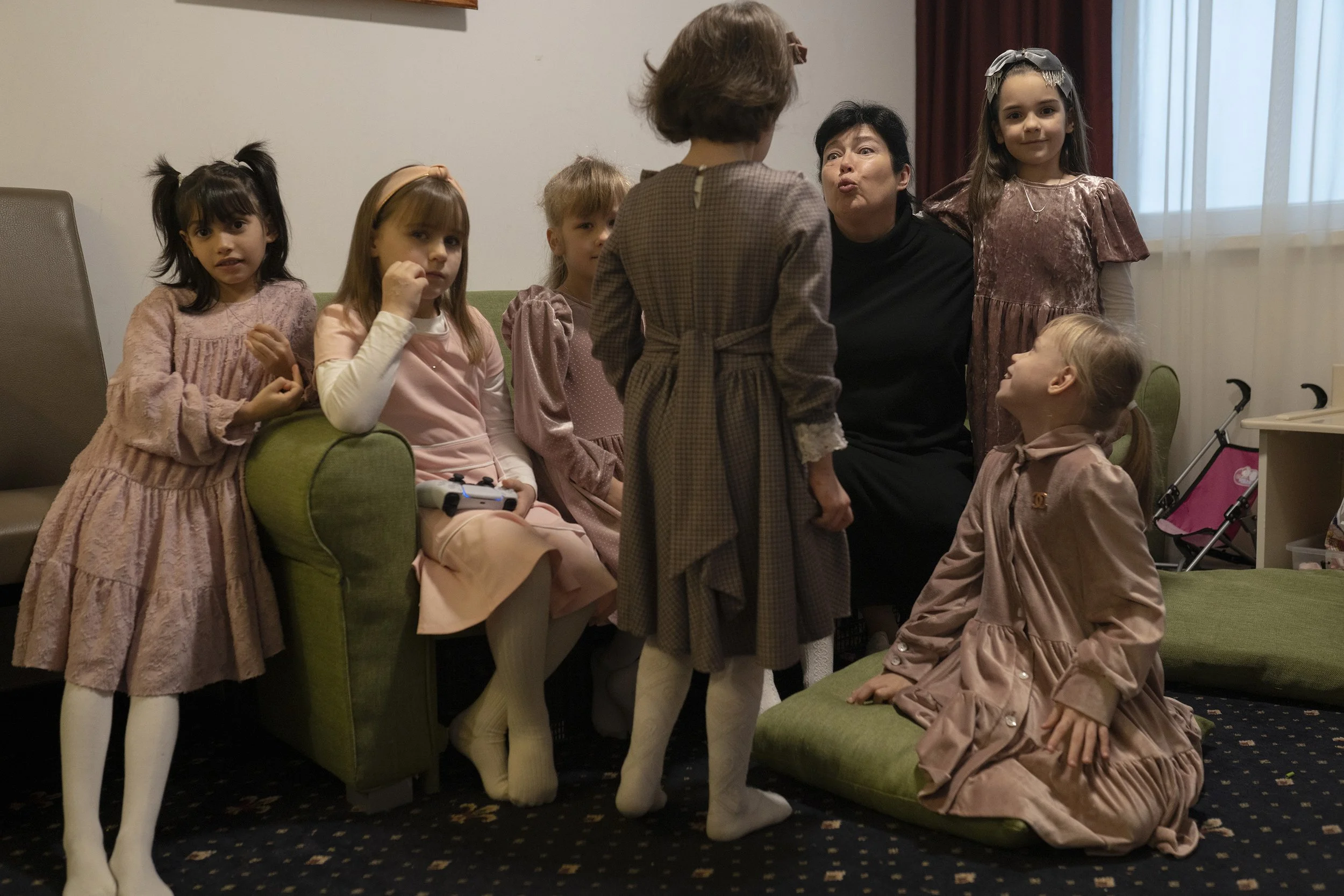  Lena Shalay, director of the Tivka Orphanage, talks to a girl before the beginning of Shabbat in the hotel in Neptun, Romania. 