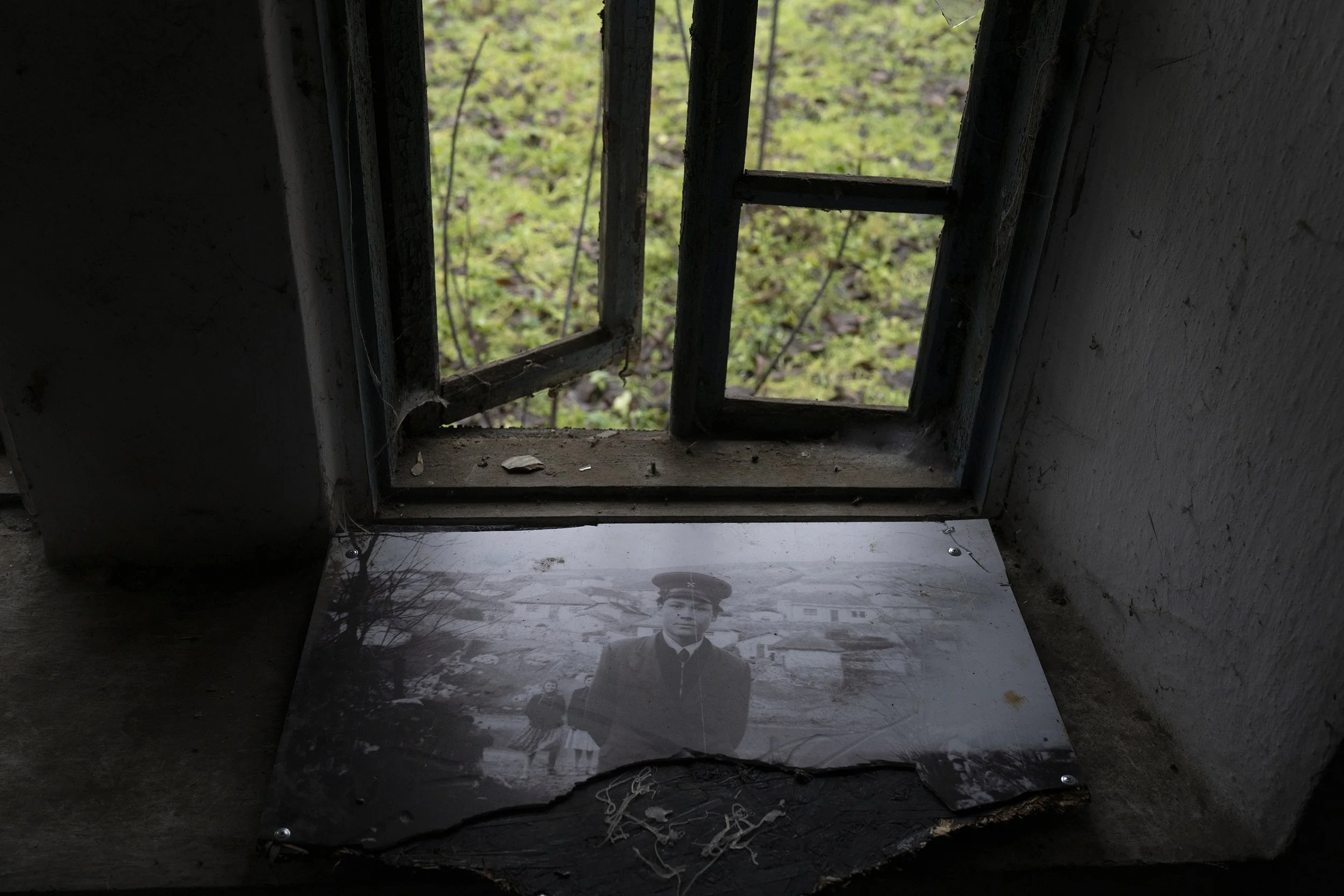  A printed photo by photographer Zaharia Cușnir lays on the window sill in his home, in Roșietici, Moldova, in 2022.  