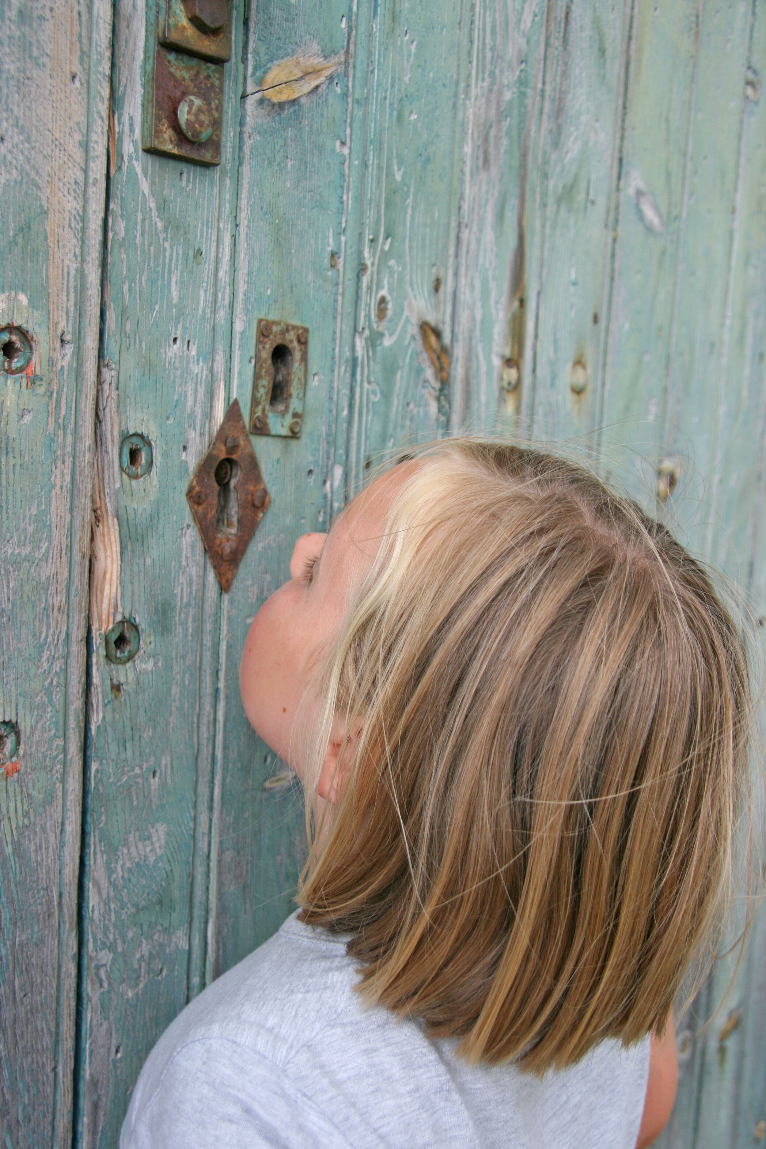 Girl Looking through Keyhole