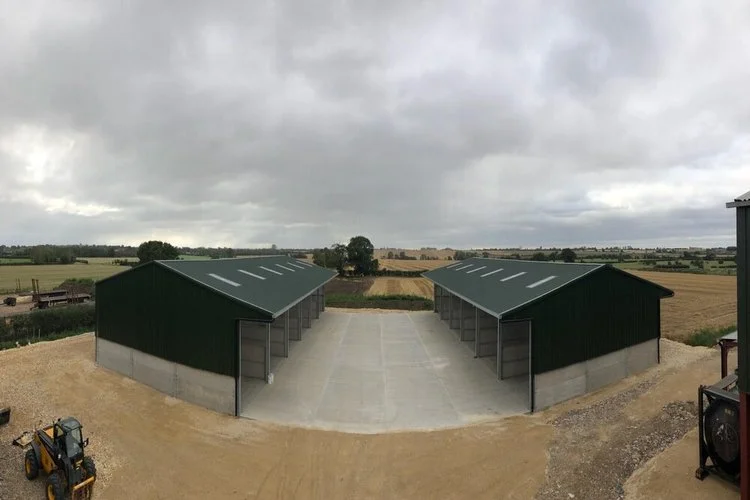 Completed agricultural storage buildings with concrete yard