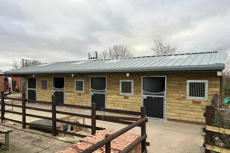 Timber riding stables with individual horse stalls constructed by AC Jackson