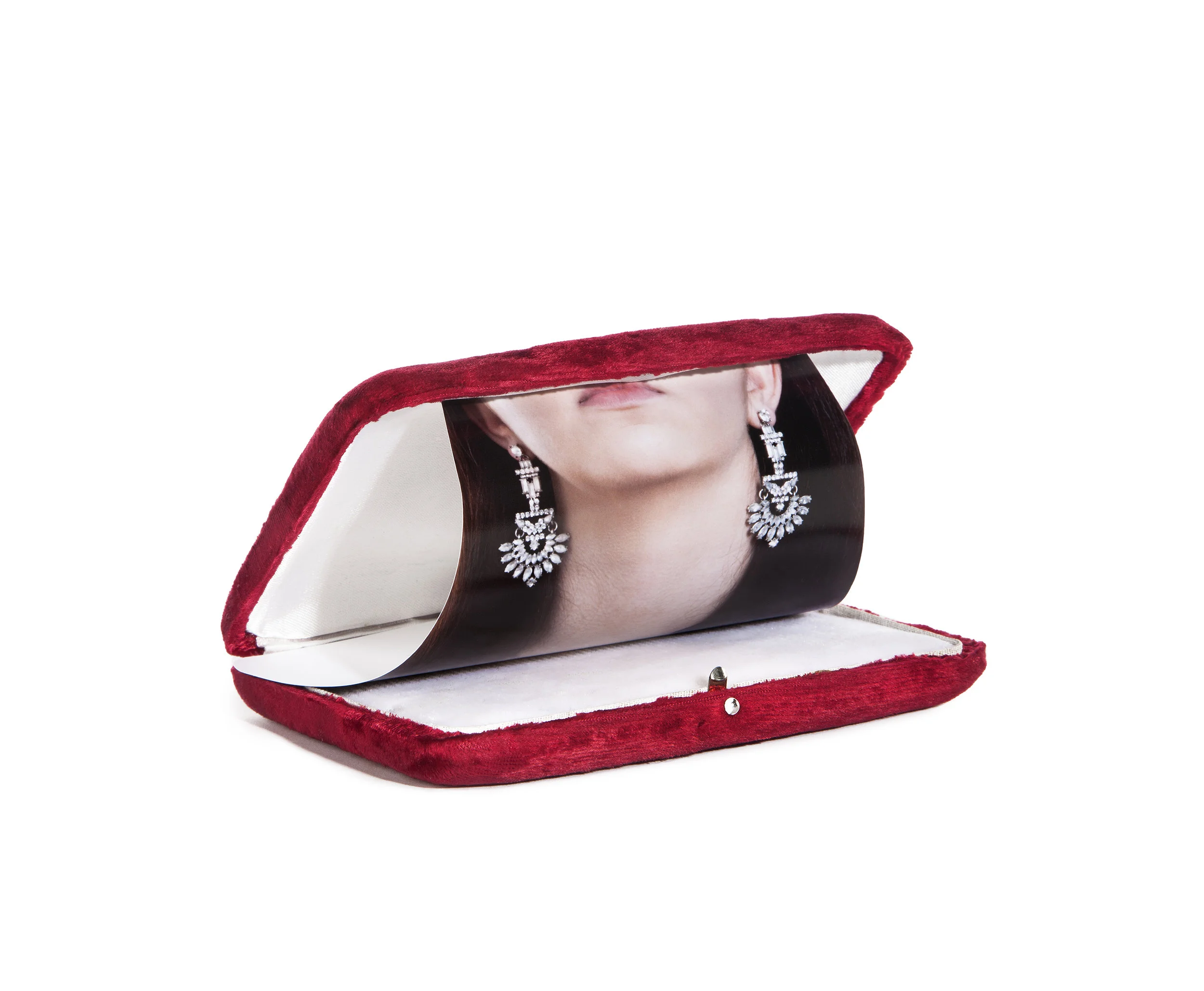 Untitled # 1, 2018, Archival inkjet print in museum shadow box, 16.75” W x 10.5”H x 6.5"D. Through deliberate, photo-sculptural visual strategies, I reveal the possibility to change (or at least interrogate) the epidemic formula of narrowly objectifying representations of female identity. By operating simultaneously on multiple levels of social, cultural, and political complexities, I employ the transformative power of photography to continually shift the register of portrayal between the subject and object-hood of the feminine. Objet Fatale re-invests women’s bodies with layered, complex, frustratingly ambiguous, and rich meaning to empower women, not to reduce them to simple objects of desire.