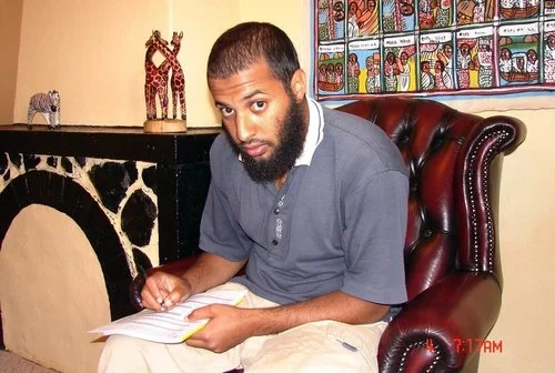 This photo taken in 2007 by a U.S. consular officer and submitted by the subject's father, Mohamed Meshal, shows Amir Meshal, of Bloomington, Minn., filling out a U.S. passport application at Ethiopian National Intelligence and Security Service headquarters in Addis Ababa. Over the past year, Meshal has been banned from at least two suburban mosques over concerns about his influence on young people