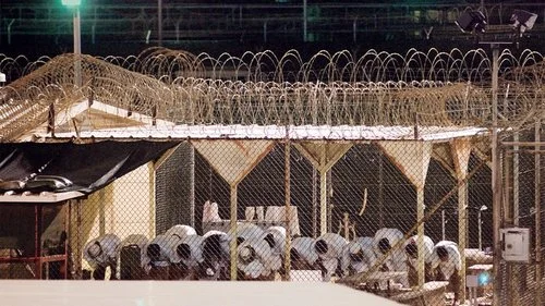 Guantanamo prisoners at prayer in 2009. Gitmo was designed to be "the legal equivalent of outer space," according to the Bush administration. Photo: Louie Palu/ZUMApress.com