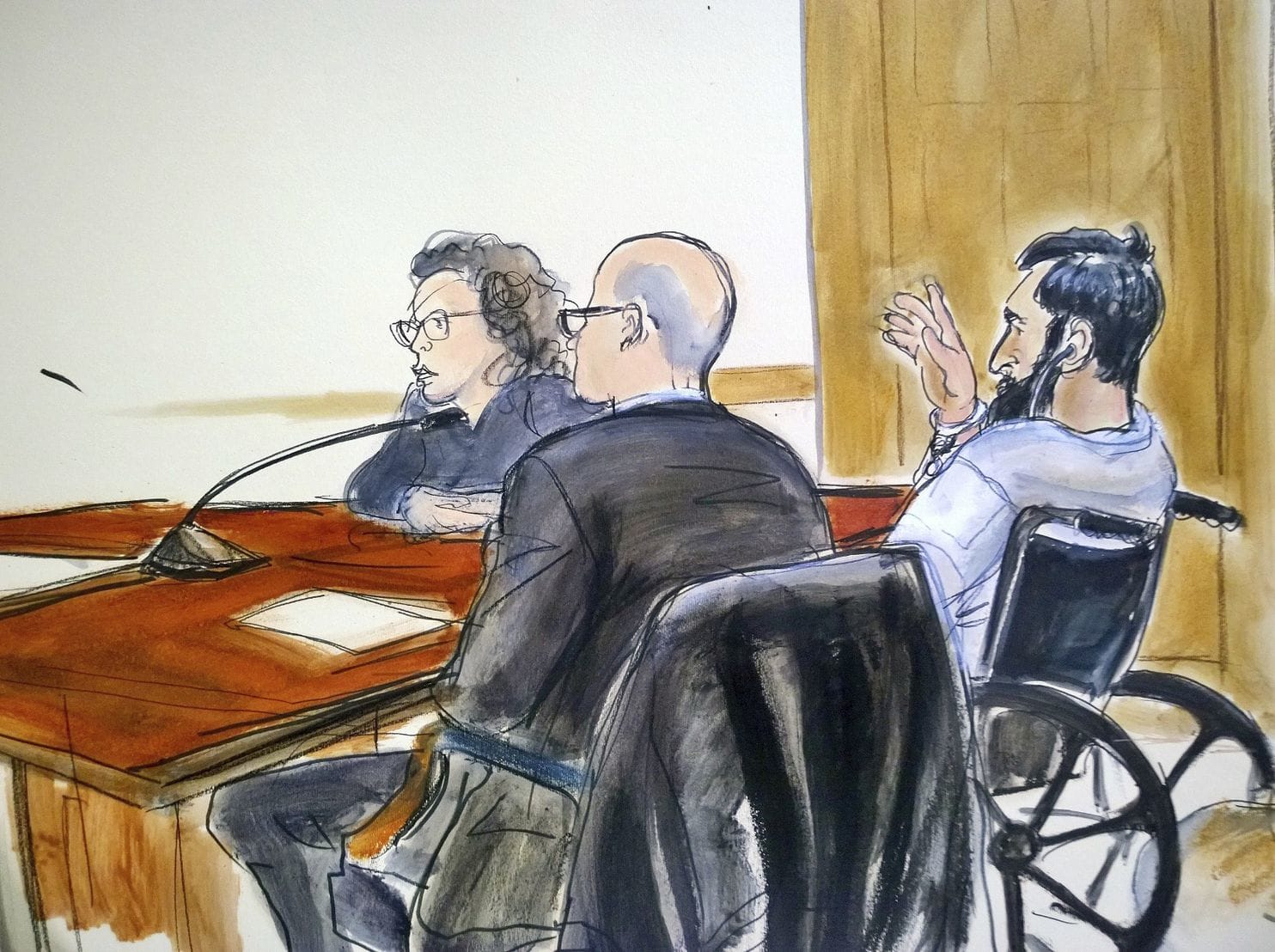 In this courtroom drawing, defendant Sayfullo Saipov, right, addresses the court during his arraignment on federal terrorism charges. The Uzbek immigrant is charged in the Oct. 31 truck rampage in New York that left eight people dead. (Elizabeth Williams/AP)