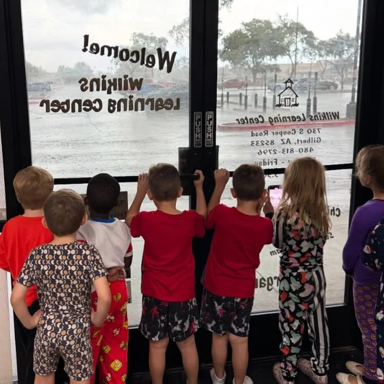 When rain shows up in Arizona, even our students pause to admire 🌧️