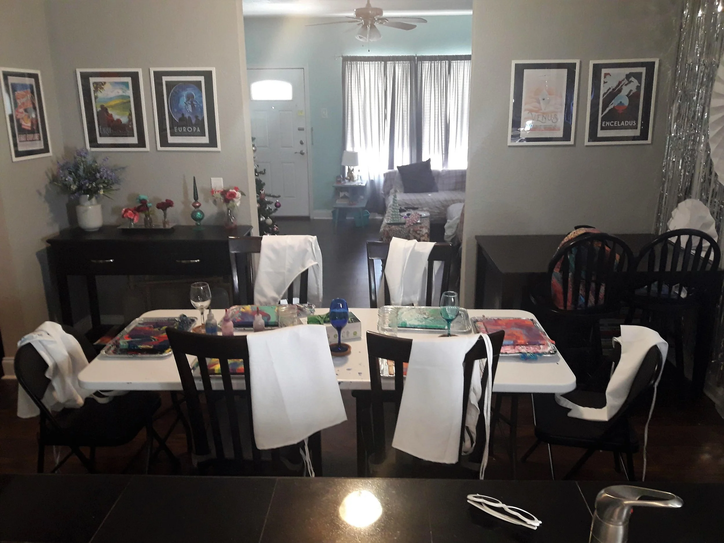 And here you can see where I scoot our dining room table out of the way, and my favorite NASA space posters that line the dining room. Cozy and creative, right?