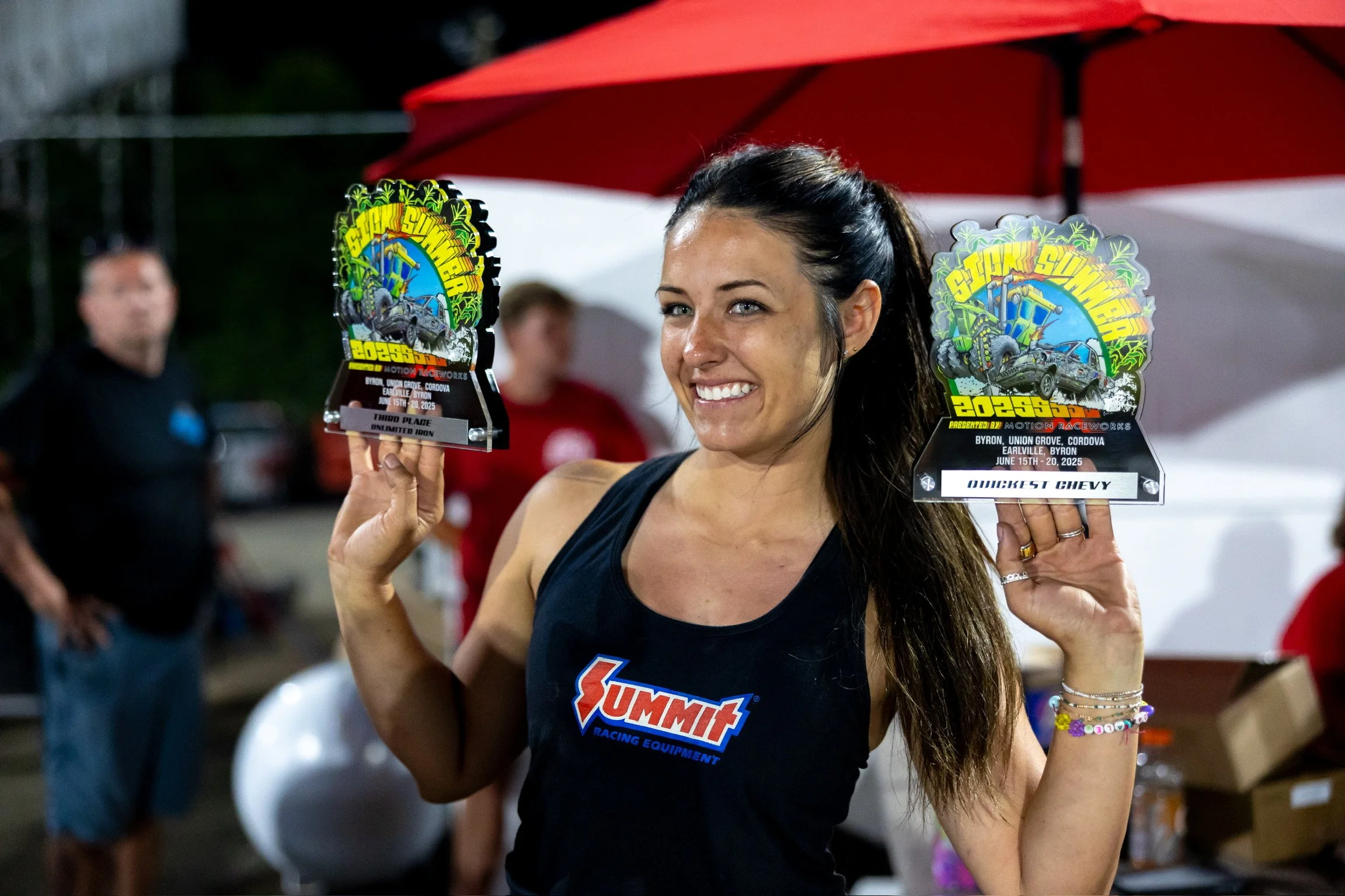 Alex standing with Sick Summer awards with Summit Racing Equipment logo tank top