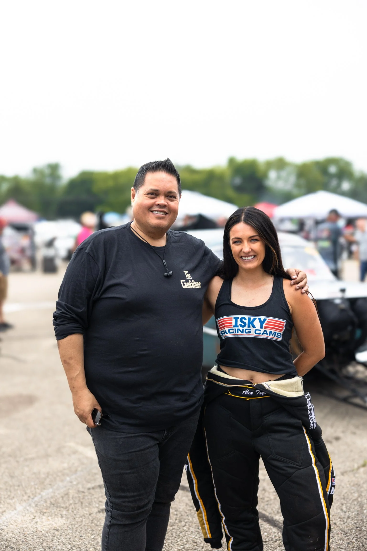 Nolan from Isky Racing Cams and Alex with an Isky Cams shirt on are standing together for a picture at Sick Week