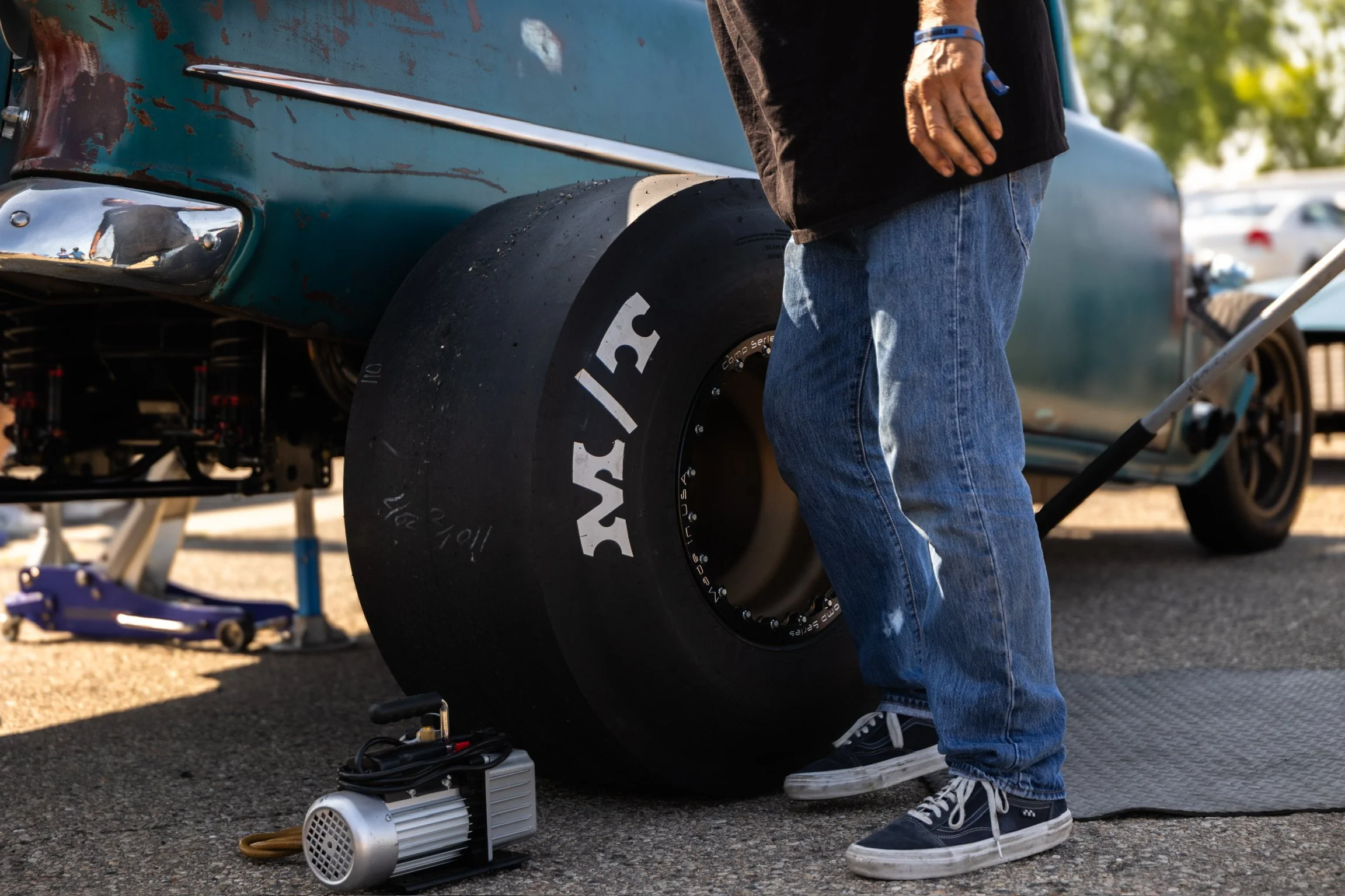 MIckey Thompson slick is sitting beside the 55 waiting to be mounted.