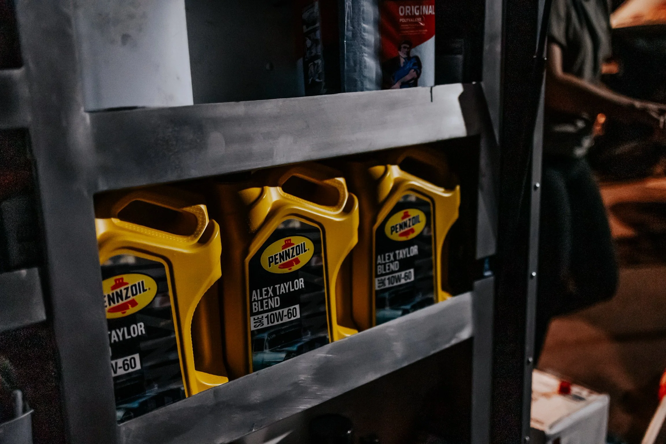 3 Alex Taylor Blend SAE 10W-60 Pennzoil bottles in Alex and Dennis Taylor's Drag and Drive Trailer