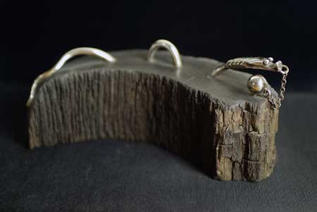 Silver and Bronze w/Aquamarine crystal, 3x1.5 in; on Black Oak.