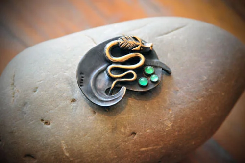 Bronze Leaf and Dragon w/Green Garnets in Silver on Granite stone base.