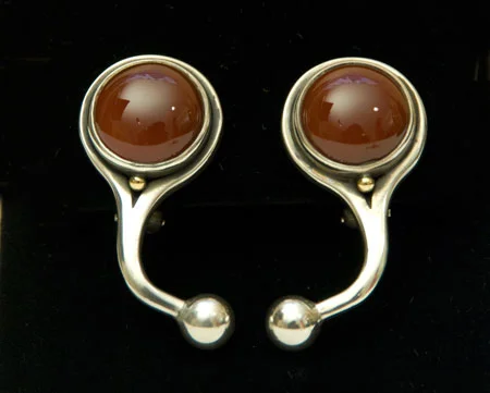 Earrings: Carnelian, 15 mm diam.; Silver w/18kt Gold.