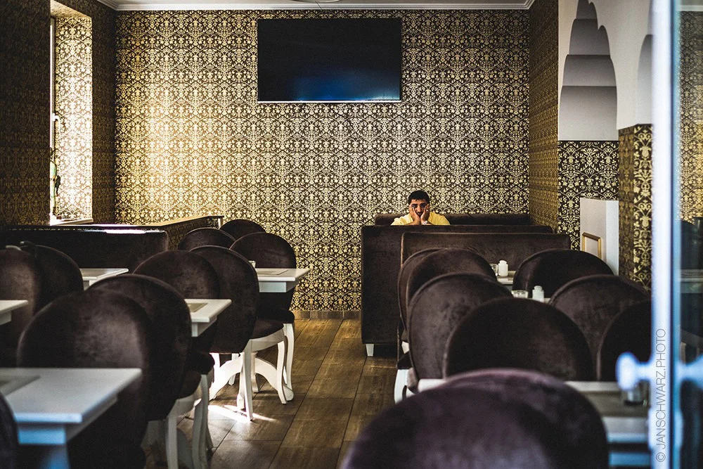 I don't think I would have taken this image with a DSLR. Guy looked grumpy enough already!