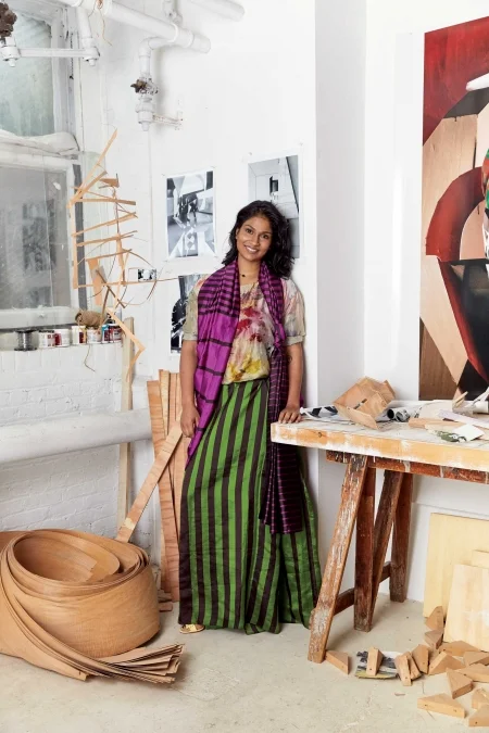 YAMINI NAYAR. Silk top, Yavi. Cotton silk sari, Payal Khandwala. Leather heels, Christian Louboutin. Metal ring and necklace, Nayar’s own