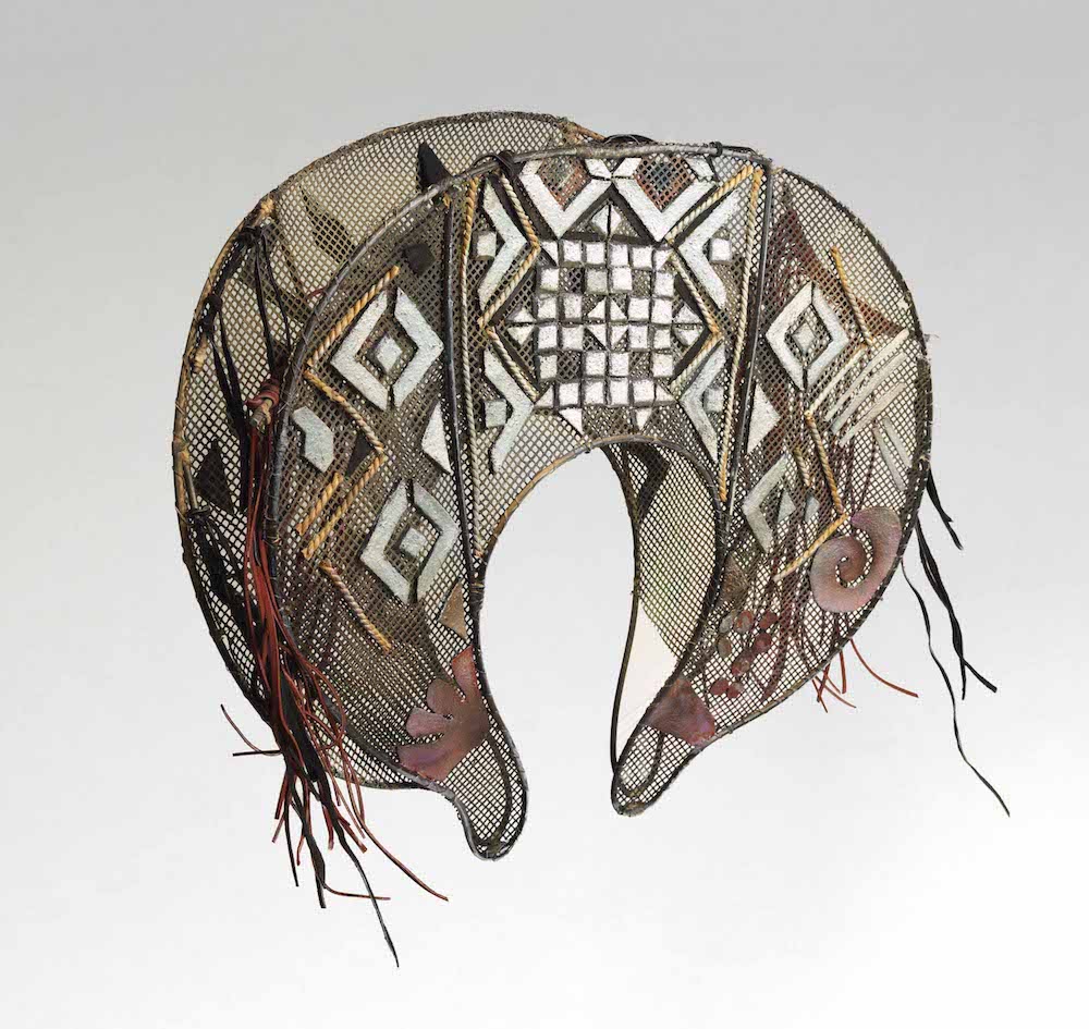   Double-sided mask for head [for the play Opus Siniestrus] , 1976, Designed by Leonora Carrington, crafted by Jane Stein and Vita Giorgi, mesh, acrylic, felt, cane, yarn, leather and velvet ribbon, 22 9/10 x 64 1/2 x 13 inches [with tape] (58.2 x 64