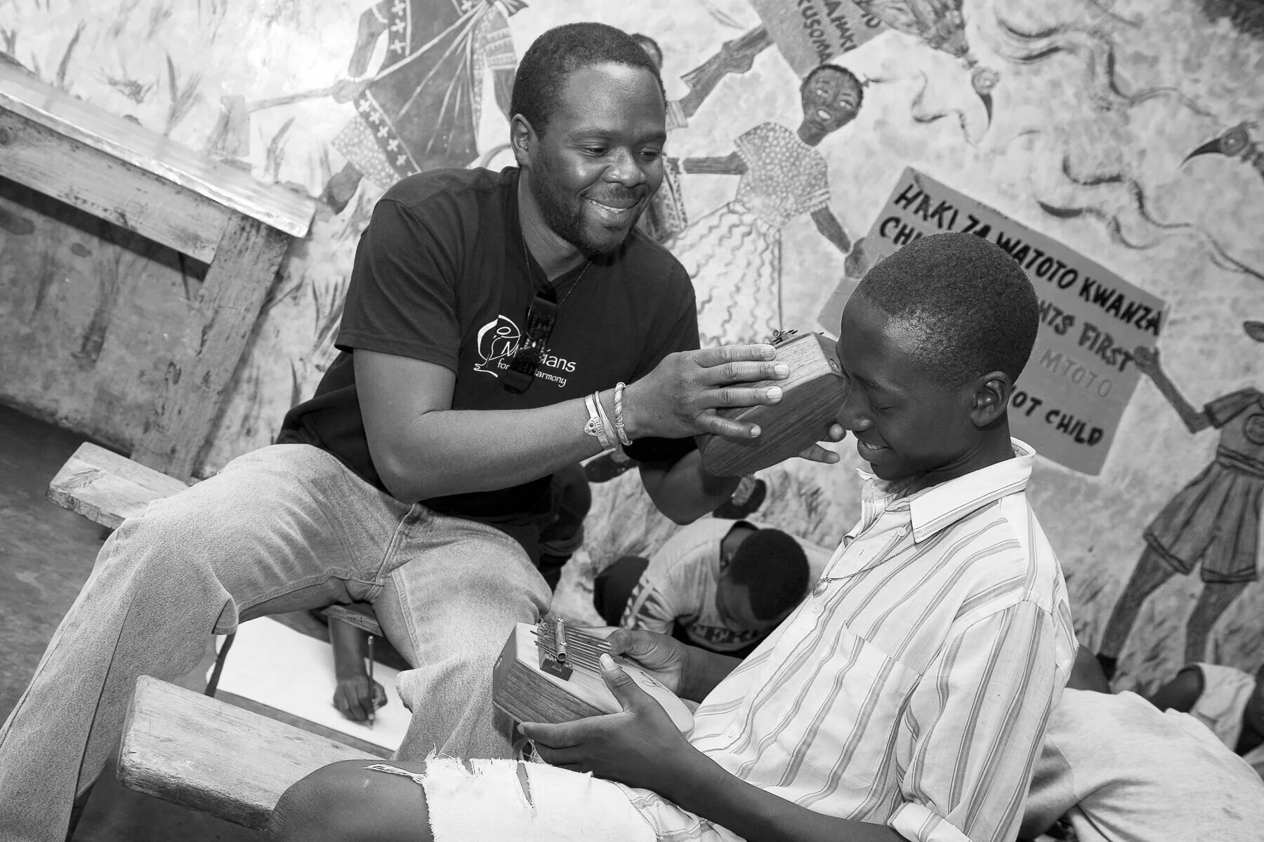 Samite and boy with kalimba.jpeg