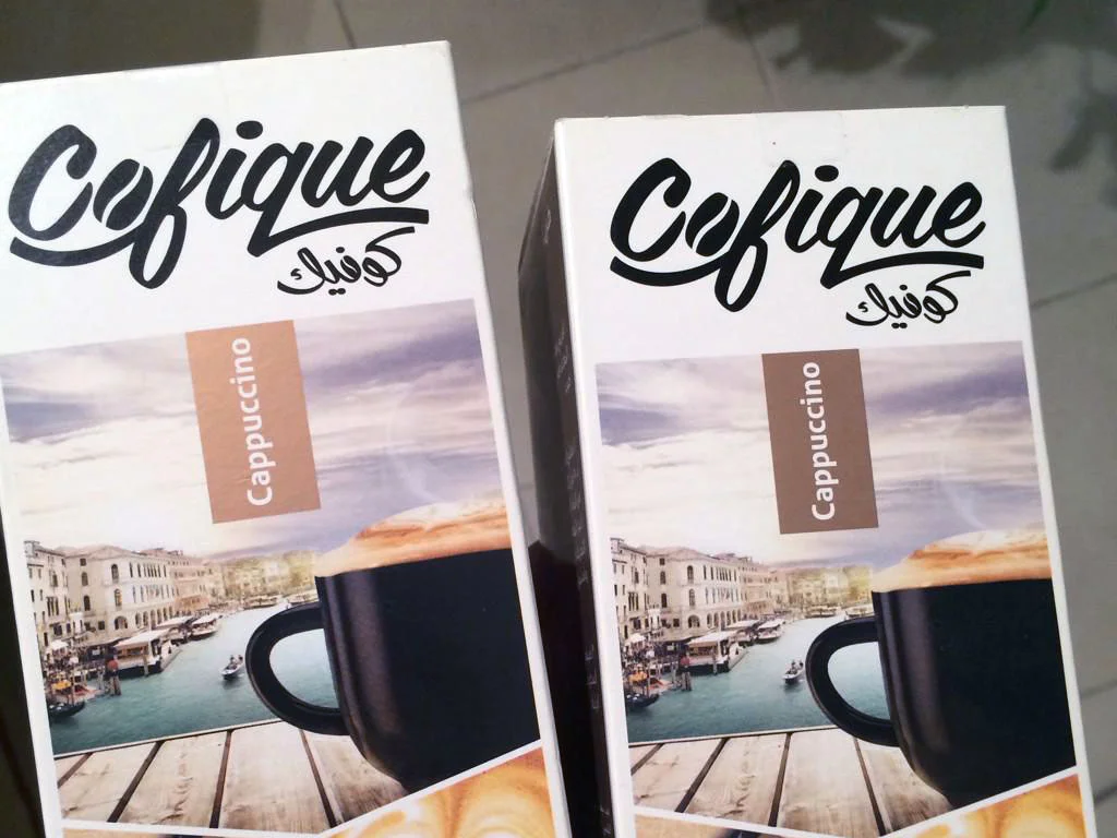 Cofique instant coffee bilingual logo applied to packaging Role: Senior Brand Designer, Rayat Brands