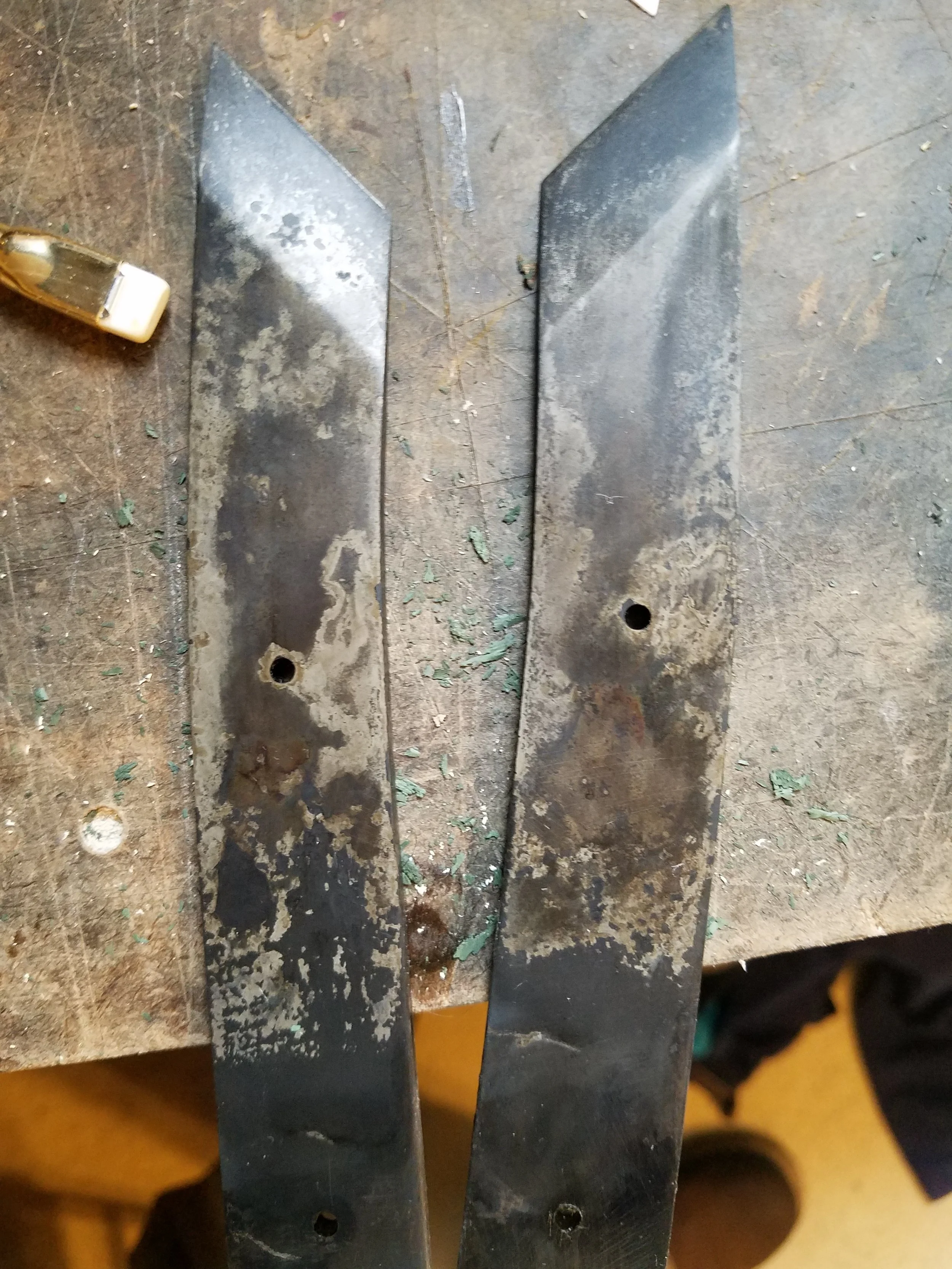 A pair of Kiridashi just out of heat treat and tempering, these will get fit with a pair of custom wooden scaled handled, sharpened out and sent out to their customer.