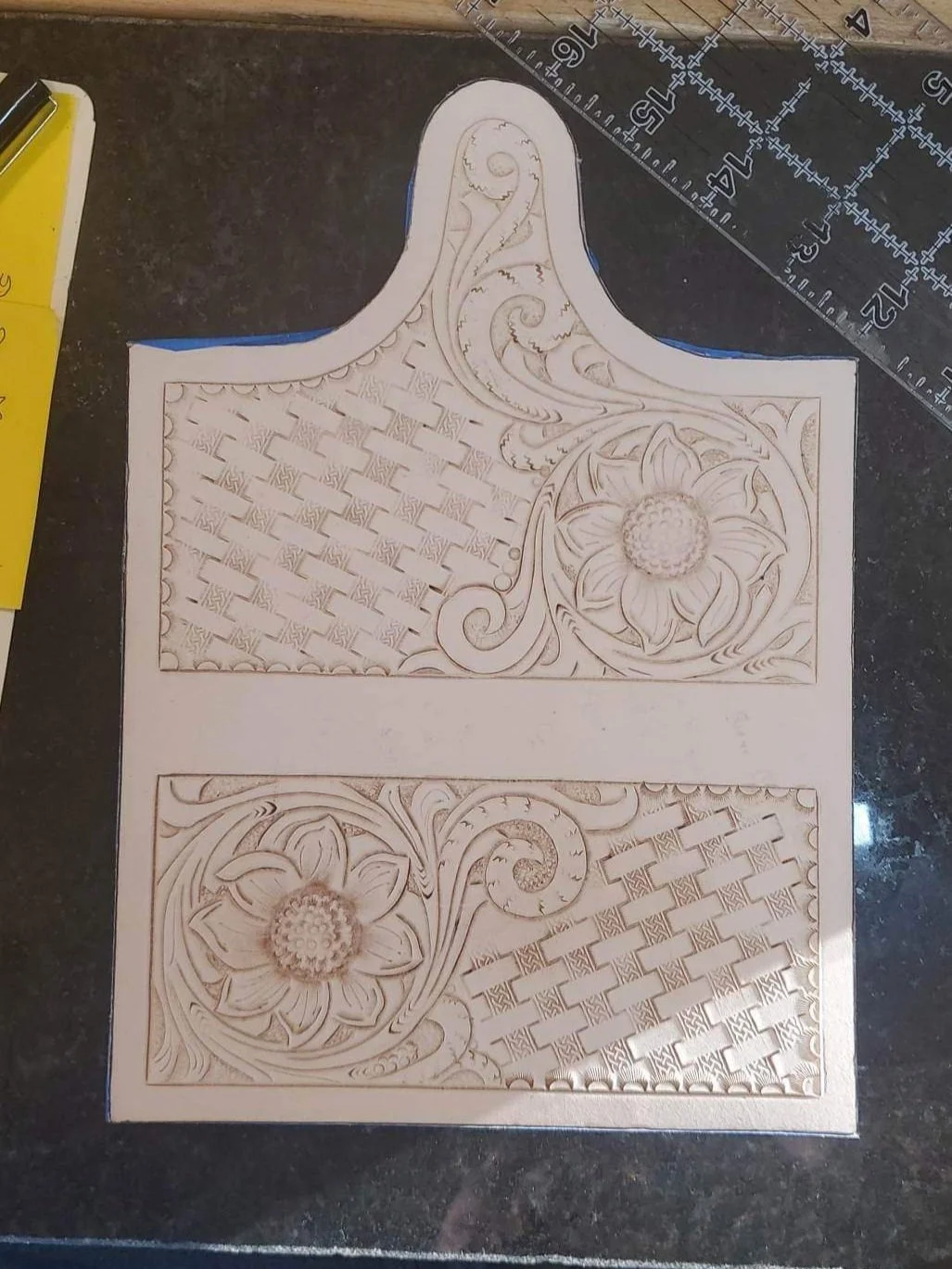 Fully tooled, womens leather clutch.
