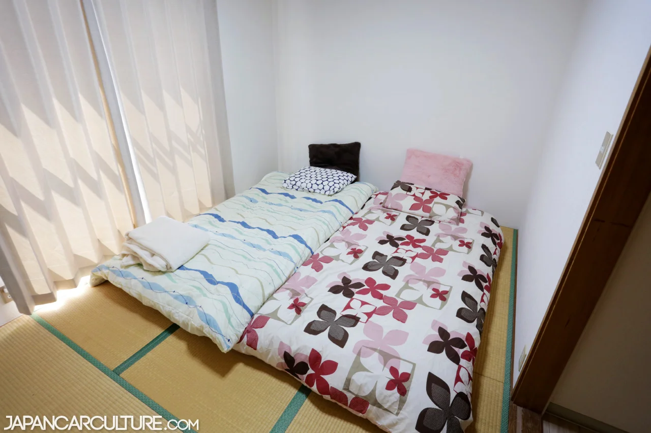 Two futon beds in a traditional tatami bedroom.