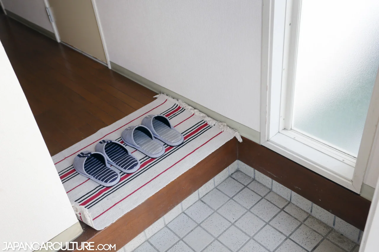 Entrance of a Japanese townhouse. Here you can see the genkan, the area where you remove your shoes.