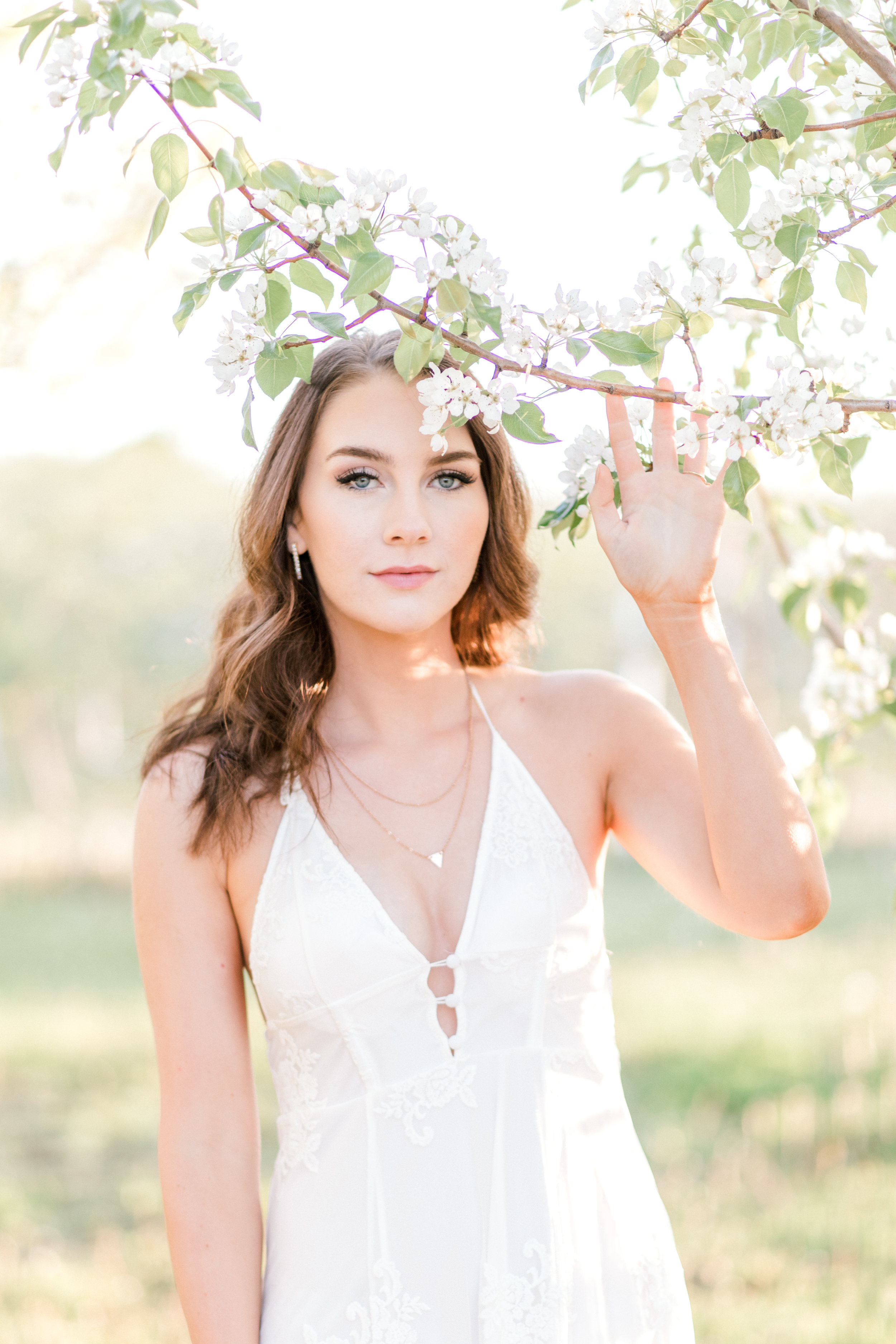 Bridal portrait ideas for bohemian bride. Apple orchard engagement photos of bride to be during sunrise engagement session.
