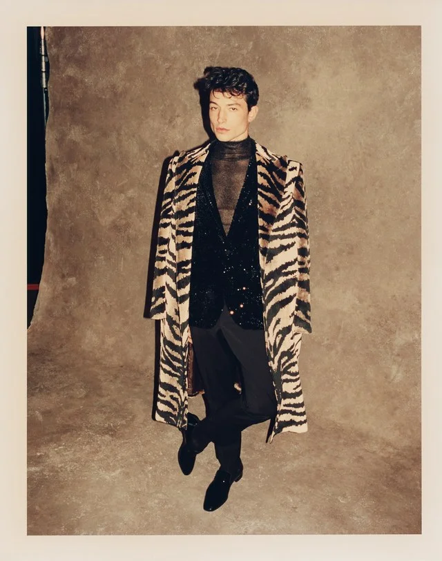 Duster coat: Alexander McQueen ($3,975); blazer: SSS World Corp ($750); pants: SSS World Corp ($275); turtleneck: Hermès ($1,575); shoes: Christian Louboutin ($795)