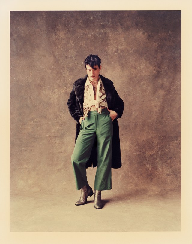Coat: Neil Barrett ($4,720); shirt: Bode ($408); pants: Bode ($728); boots: Saint Laurent by Anthony Vaccarello ($1,095); necklace: Tiffany + Co. ($10,000)