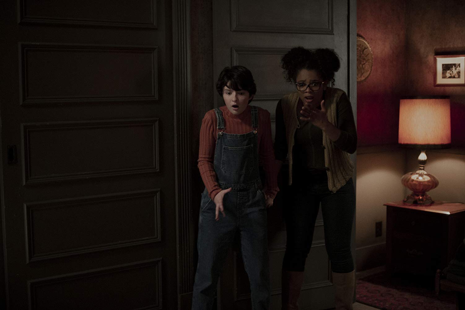 Lachlan Watson as Susie Putnam alongside Jaz Sinclair as Roz