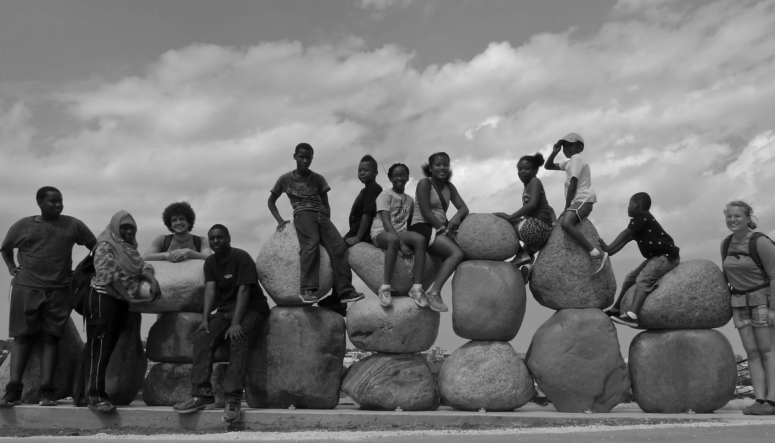 "Bridge" is composed of 20 local glacial boulders, selected by the artist, Peter Flanary, for form and color, and averaging two feet in diameter each. The artwork relates to the Menomonee River Valley landscape, and explores the idea of "connection" in broad and various ways. This sculpture is located in Three Bridges Park near the Potawatomi Bridge .View a video of the sculpture's assembly. (Photo: Peter Flanary)
