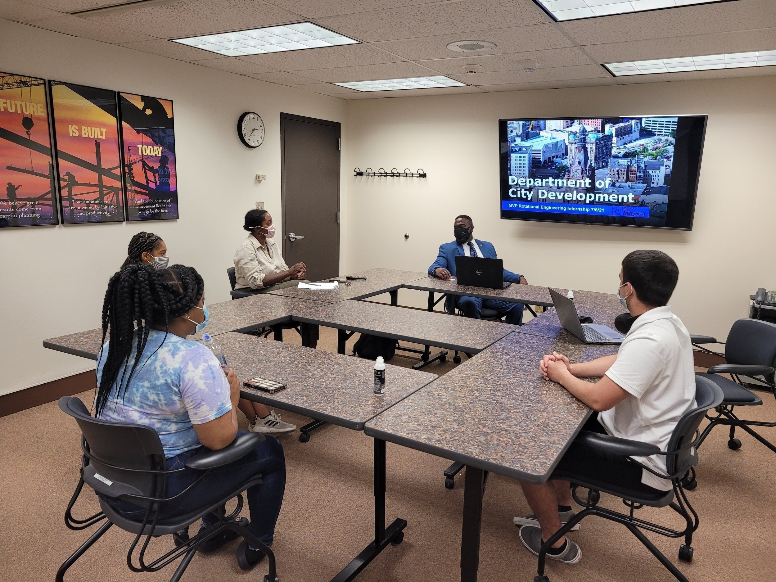 Interns learn about the Department of City Development from Commissioner Crump