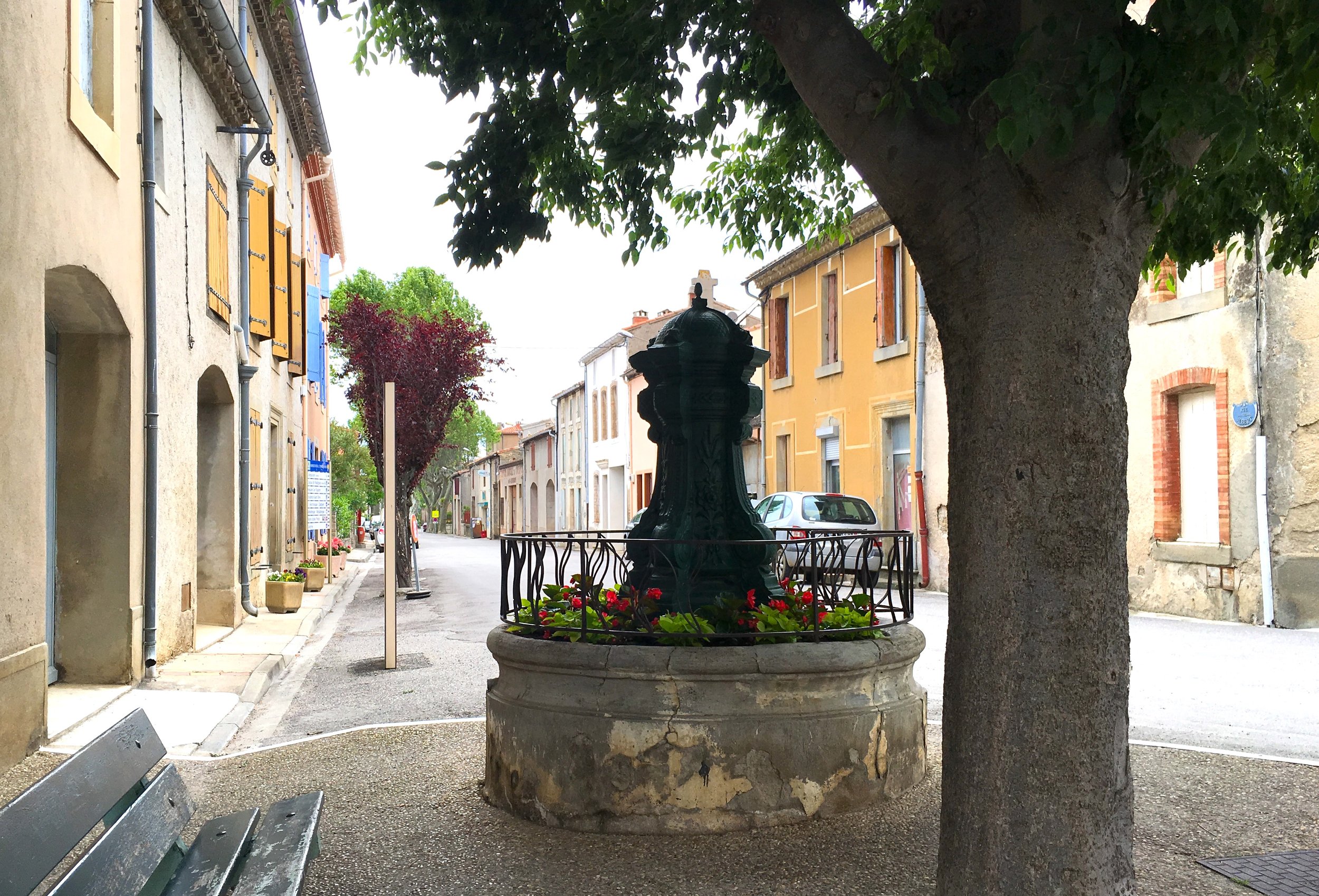 Past the fountain and you'll find the Epicierie for your morning baguettes, croissants and espresso. (Copy)