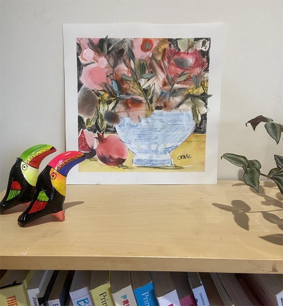 Pomp and Pomegranates painting by Catherine Jennifer on a shelf in the artist's studio