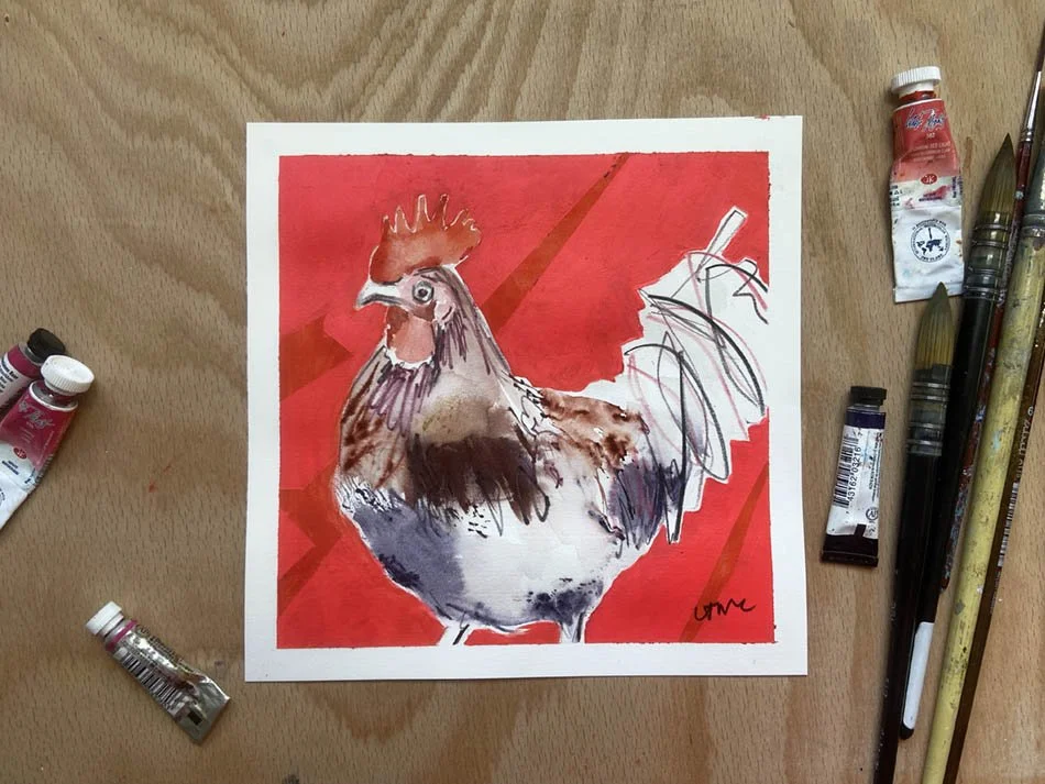 Colourful original watercolour painting of cockerel with red background and artist materials