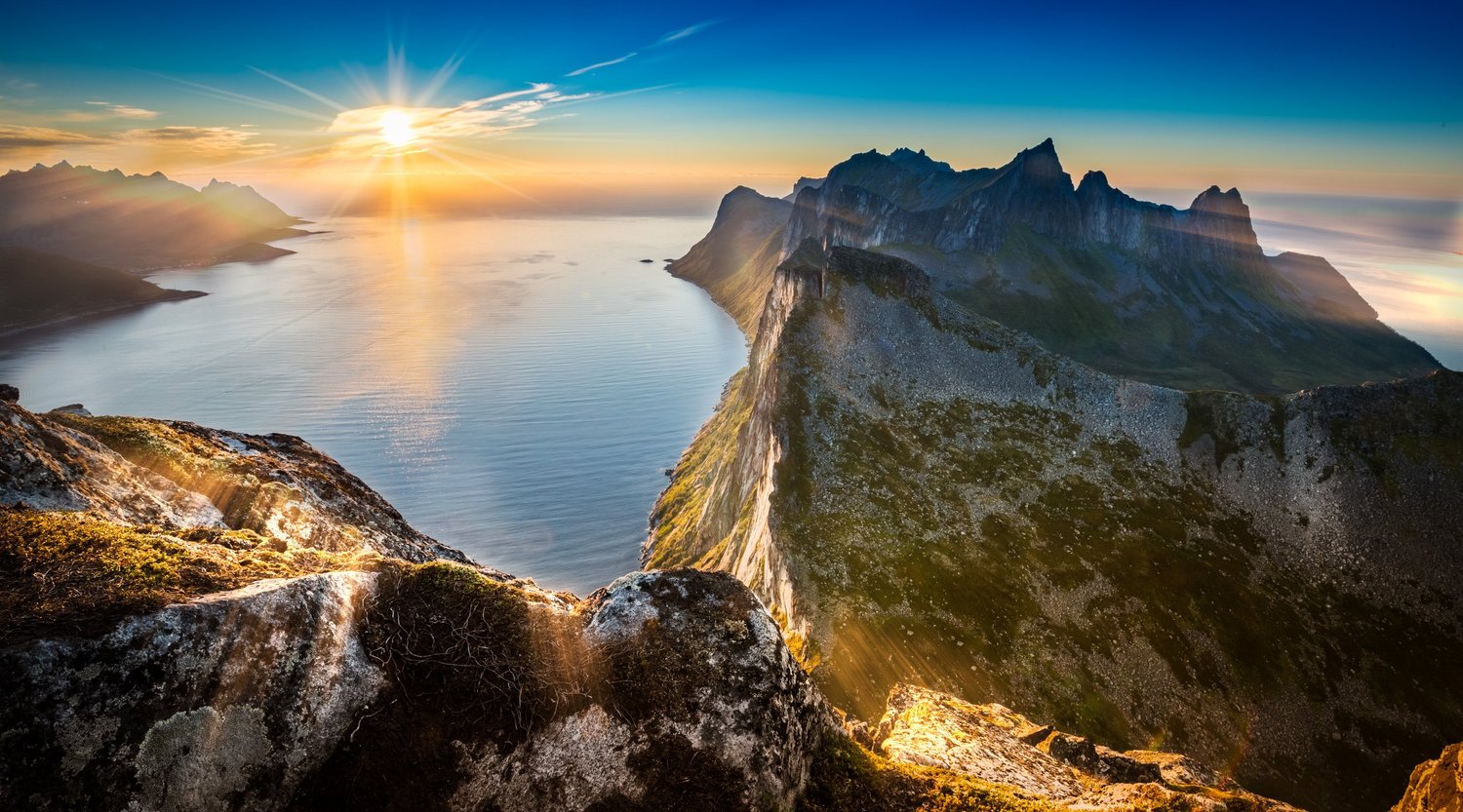 Charter guests sailing in the summer landscape of Senja Island